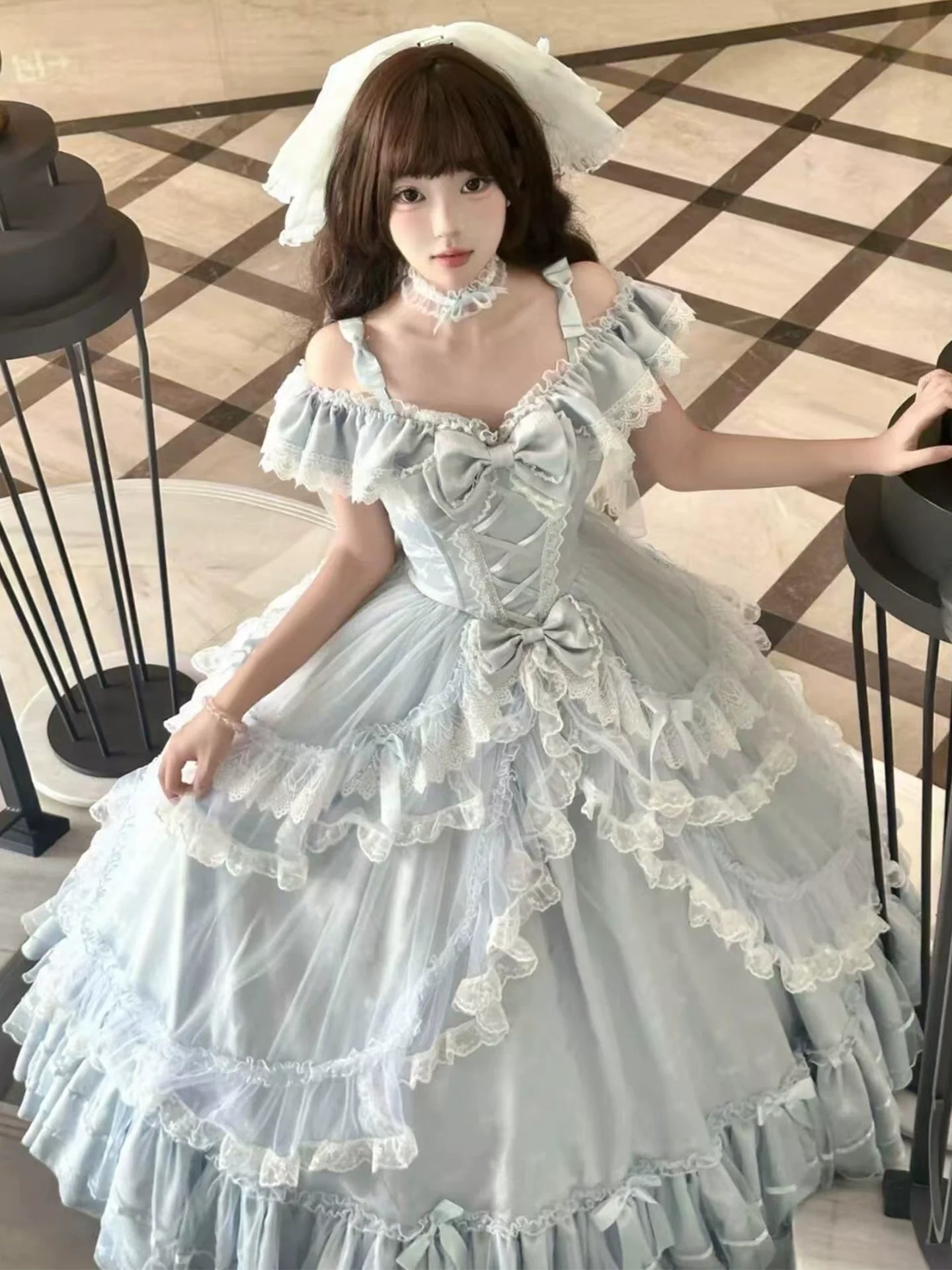 Off - the - shoulder Lolita Gown with Intricate Lace and Multiple Tiers of Ruffles