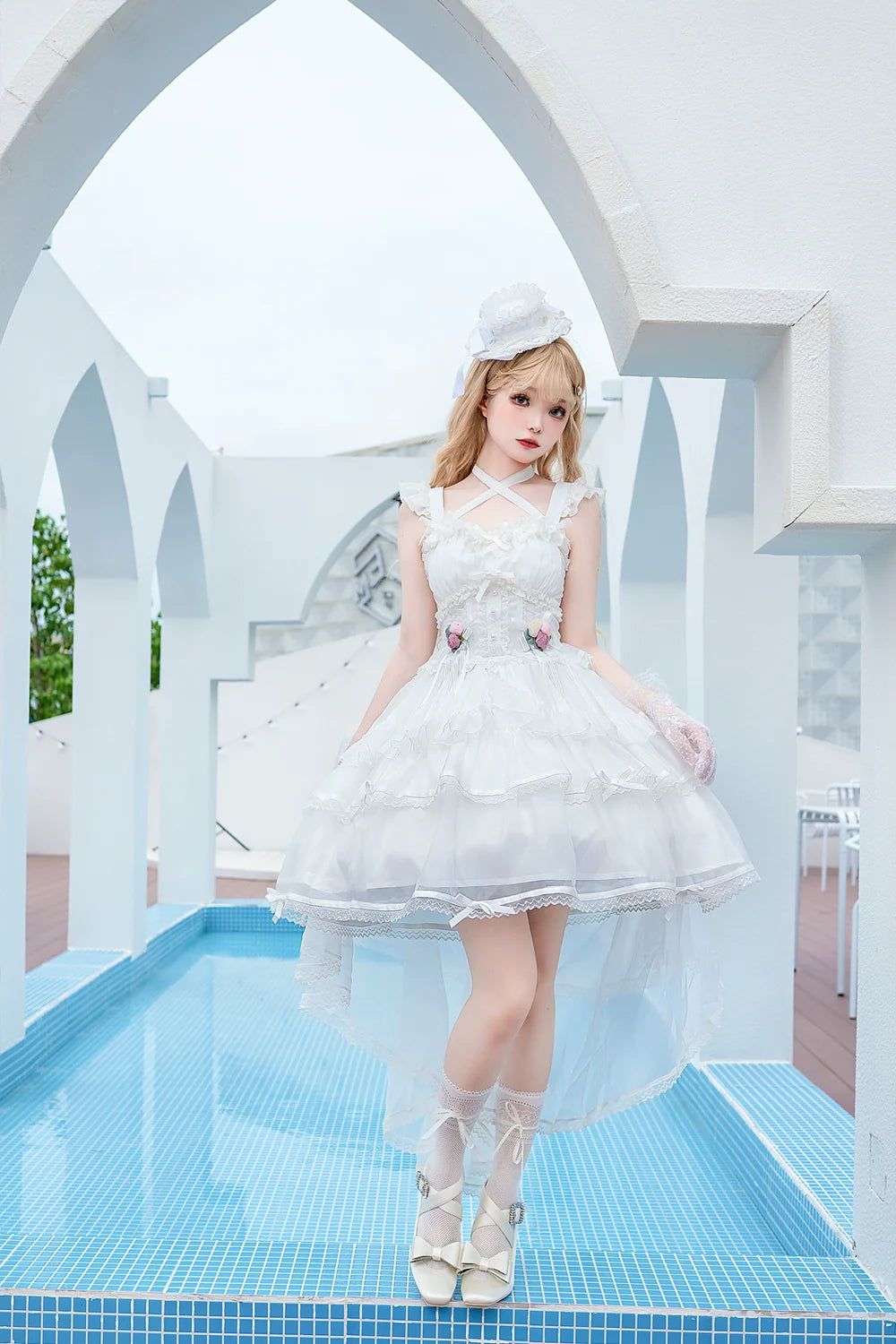 Elegant, lightweight wedding-style Lolita dress with a ballet-girl silhouette and ruffled details, inspired by cotton-candy motifs