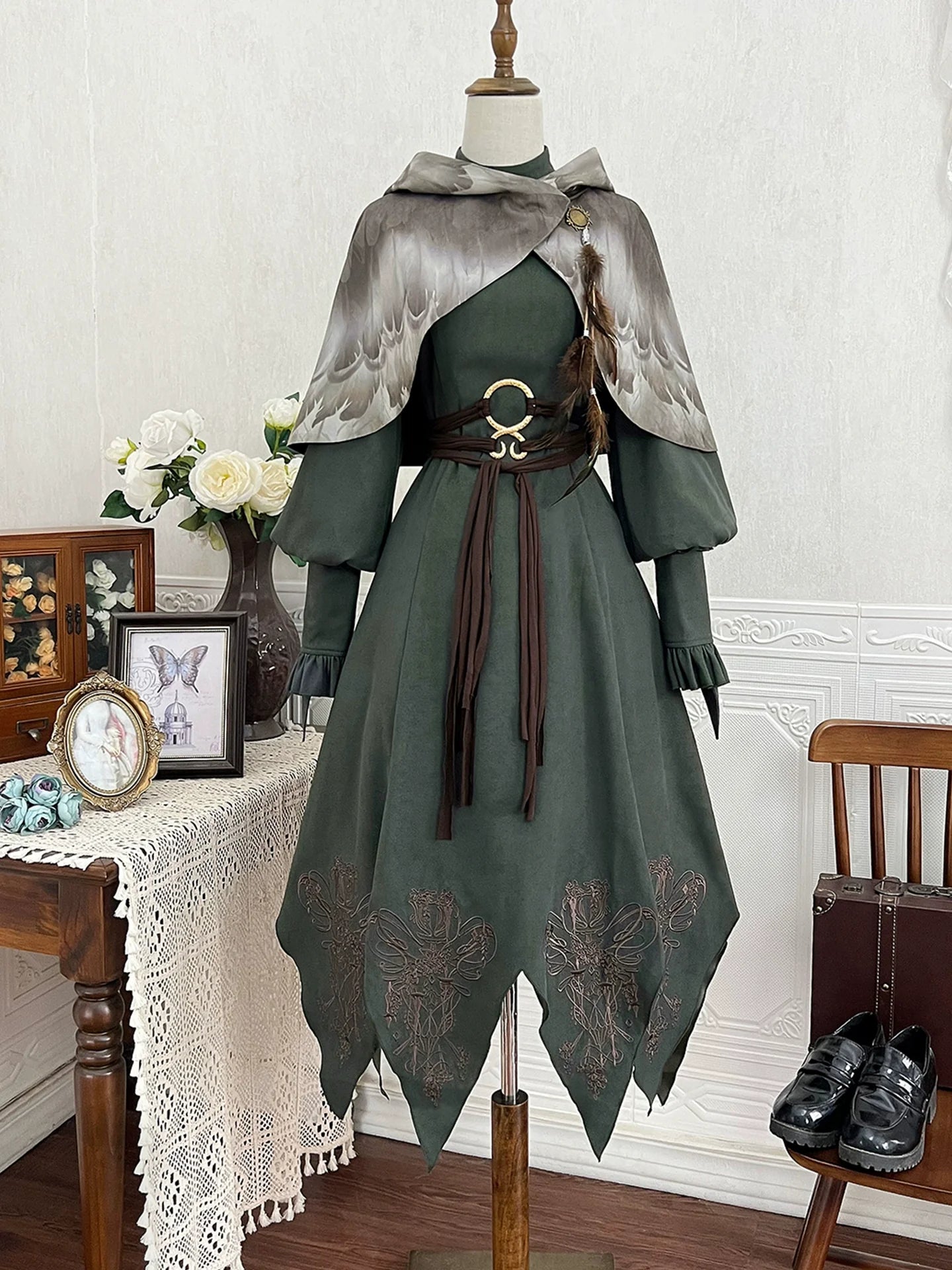 Fantasy - Style Capelet Dress with Embroidered Hem and Buckled Waist Belt