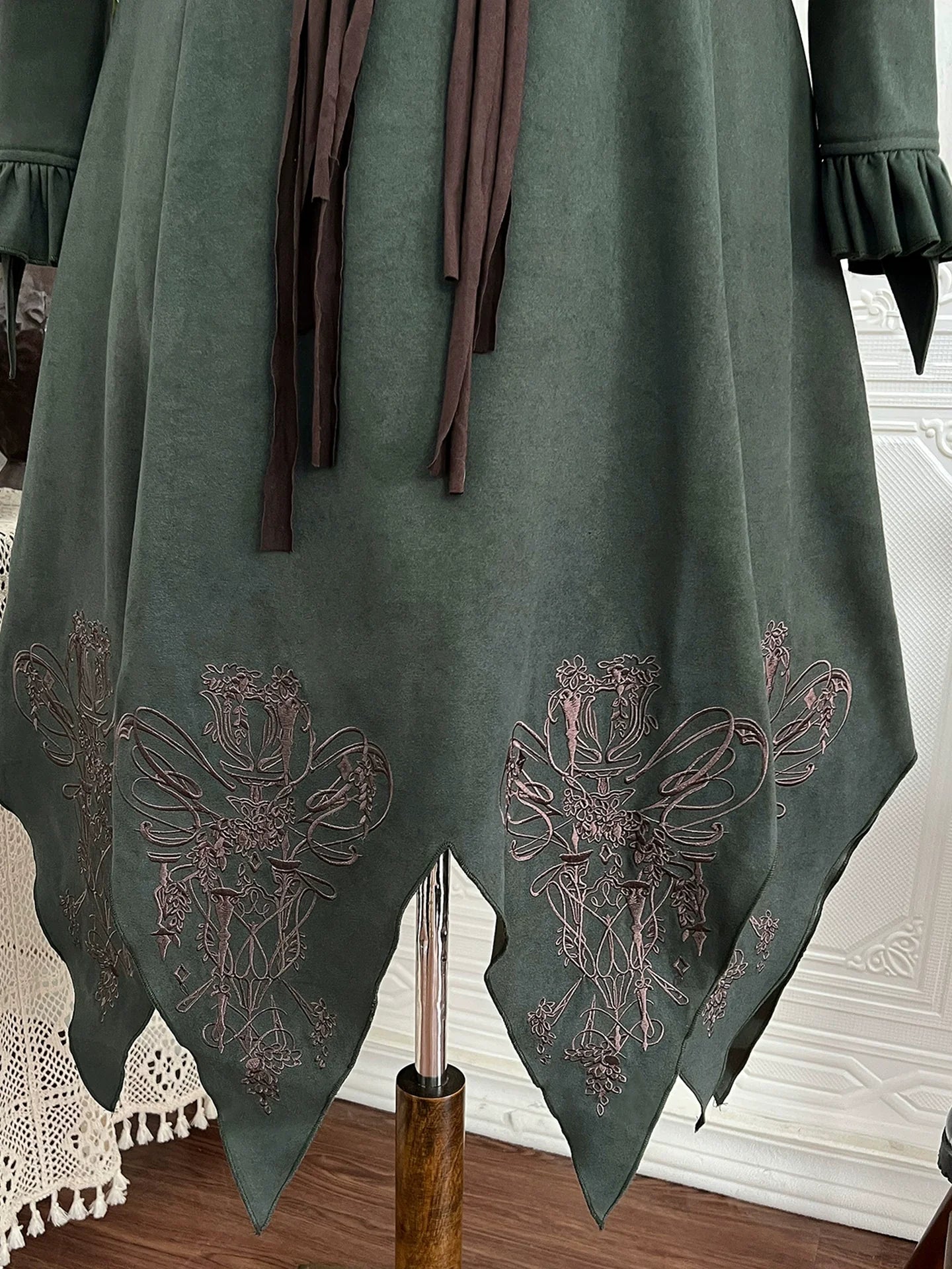 Fantasy - Style Capelet Dress with Embroidered Hem and Buckled Waist Belt