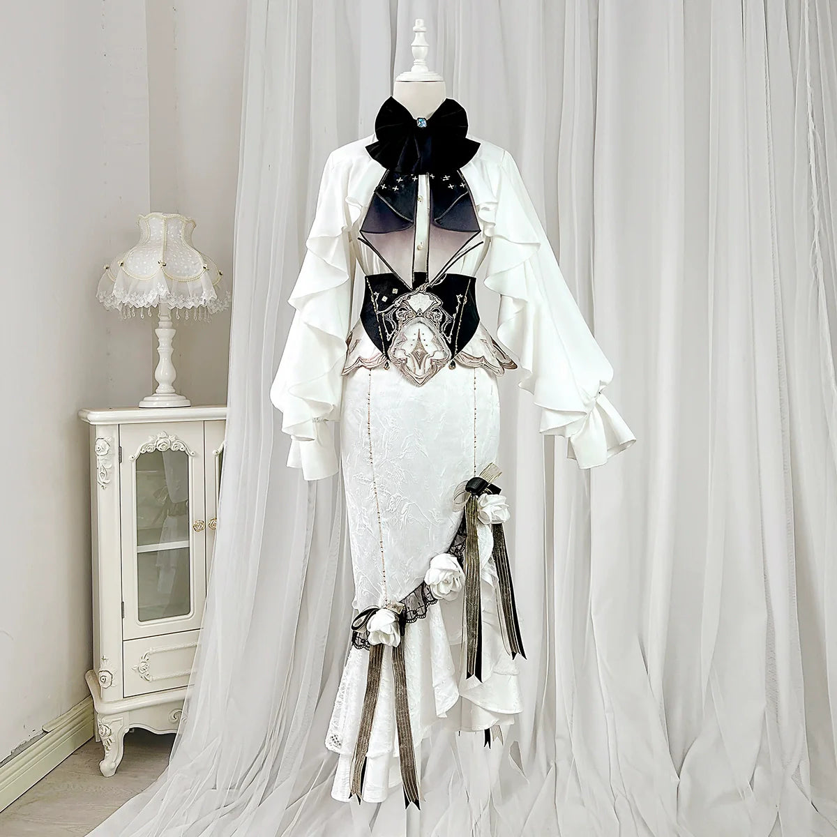 White Gothic-style dress set: court-inspired top and mermaid skirt with waist belt